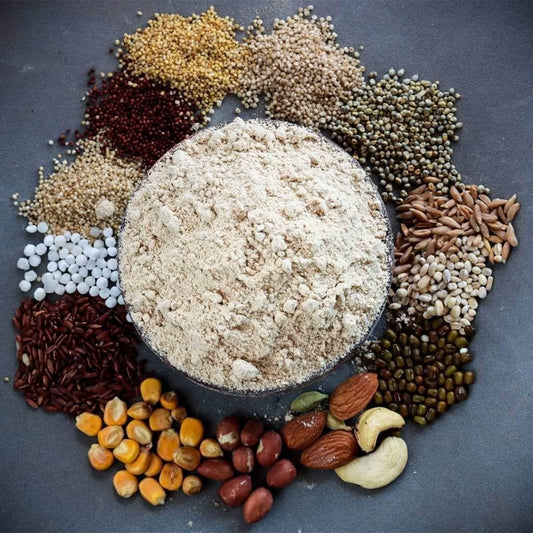 Grains, nuts and dried fruit arranged on a dark plate – dates powder in everyday cooking