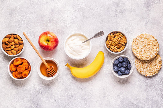 Bowls of nuts, seeds and dried fruit – ingredients for traditional postpartum laddus